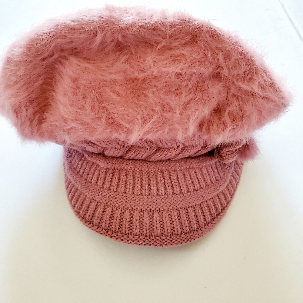 Fuzzy pink and knitted Winter hat